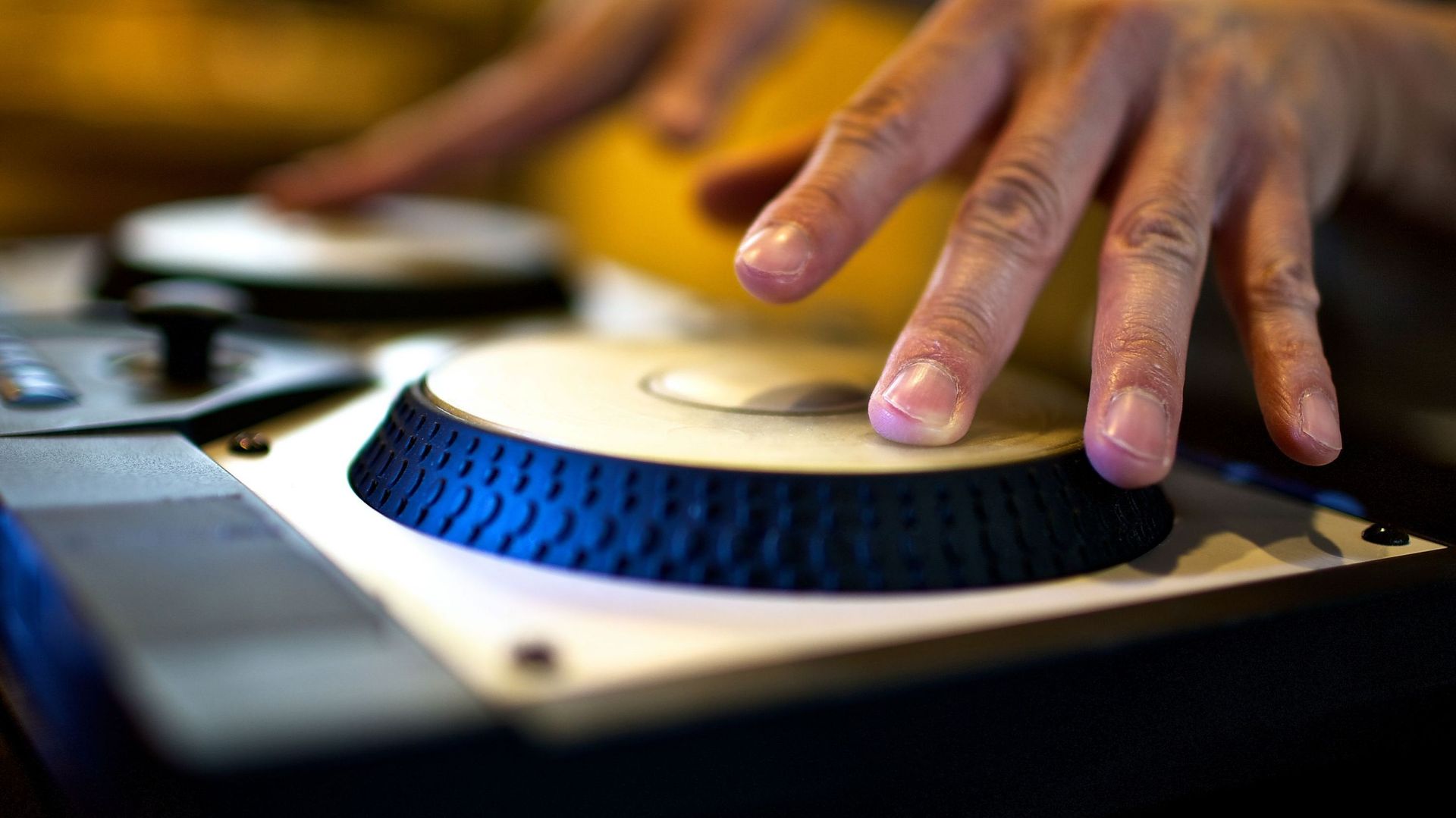 DJ mixing up music using digital turntables.
